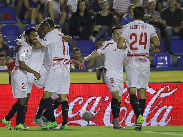 Sevilla's French midfielder Steven N'Zonzi (2ndL) celebrates his goal with teammates during the Spanish league football match Levante UD vs Sevilla FC at the Ciutat de Valencia stadium in Valencia on September 11, 2015.   AFP PHOTO/ JOSE JORDAN        (Photo credit should read JOSE JORDAN/AFP/Getty Images)